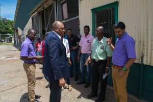 Minister of Natural Resources Raphael Trotman (left)  in talks with School Programme Coordinator of GTC Zamin Ally  (DPI photo)