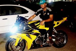 Berket King on the motorcycle he was riding last night with Mauava Chase 