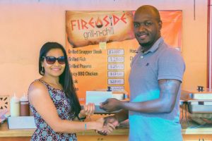 FireSide Grill and Chill yesterday provided corporate support for the GRFU 7s Rugby tournament scheduled for tomorrow at the National Park. In the photo above Ms Deodat of FireSide presents the cheque to GRFU Vice President Rawle Toney