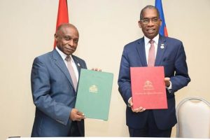 Minister of Foreign Affairs Carl Greenidge (left) with Minister of Foreign Affairs and Religious Affairs of Haiti Antonio Rodrigue after the signing of the MoU. (Ministry of Foreign Affairs photo)