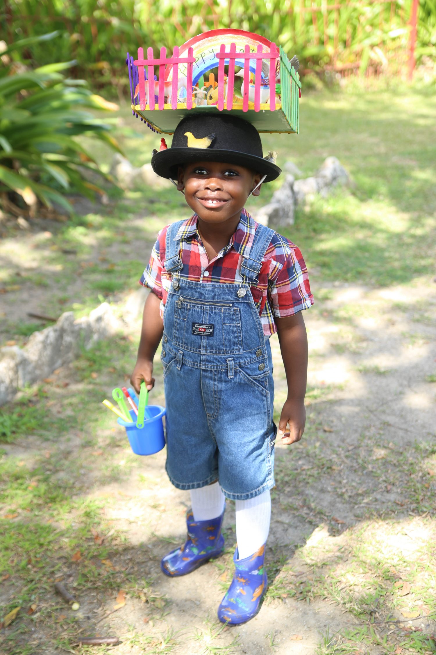 Farmer brown came to town and attended the hat show! 
This young boy wore his unique hat to the Starter’s Nursery Hat Show, which was held yesterday at the Promenade Gardens. (Photo by Keno George) 