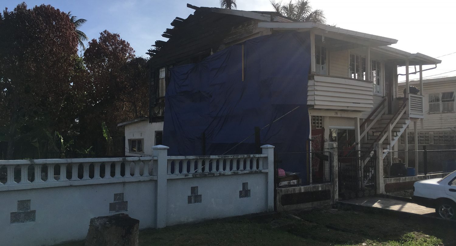 Angela Dominick’s home in Pike Street, Kitty, where she is using tarpaulin to shield her family from the elements. 