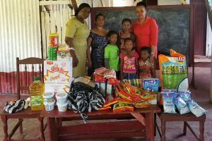 The Region Four regional administration on Friday donated a quantity of food stuff to the Pyle family. Photographed are the Regional Education Officer of Region Four Tiffany Favourite-Harvey (far left) Tena Pyle, Regional Executive Officer of Region Four Pauline Lucas and Pyle’s children.
