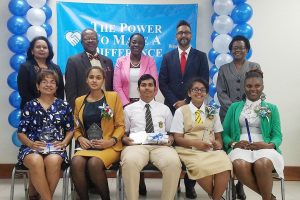 Seated from left are a representative for CAPE Awardee Shannon Woodroffe, Shania Anirood, Michael Bhopaul, Saskia Twahir and a representative for Elsie Harry.  