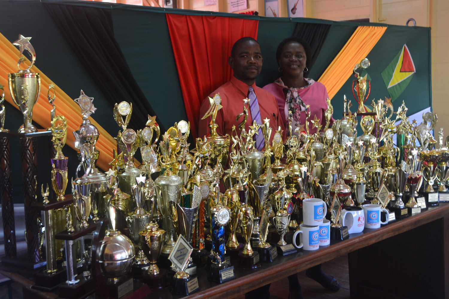 Coordinator of the STEAM Fair, Loren Park and Regional Education Officer (ag.), Tiffany Favourite-Harvey pose with the trophies that will be up for grabs.