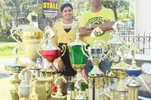  Proprietor of the Trophy Stall, Ramesh Munich and his wife, Alisha Mohamed with the trophies yesterday