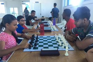 The Guyana Chess Federation hosted a Mashramani Blitz Chess Tournament recently at the National Aquatic Centre, Liliendaal. Blitz is usually referred to as speed chess and during blitz games, each player has five minutes on his/her timer to complete the game. In the photo Cassandra Khan (left) faces Saeed Ali. Khan was adjudged the best female junior chess player of the competition, while Ali, who qualified for the National Senior Chess Championship, is playing today at the Windjammer Hotel in Kitty.