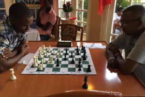 During the Senior National Chess Cham-pionship last Sunday evening at the Wind-jammer Hotel in Kitty, Loris Nathoo (right) stunned FIDE Candi-date Master Anthony Drayton (left) with a nasty single move checkmate at the height of a complicated middle game. Drayton had meticulously launched an attack on a knight on the sixth rank which was bothering him and unconsciously exposed his king to checkmate. Nathoo guaranteed the gift of a checkmate for his opponent with his queen. 