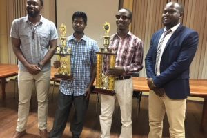 When the National Chess Championships ended on Monday evening at the Racquet Centre, Wendell Meusa and Joshua Gopaul were victorious. They won the Senior and Junior titles respectively. In photo from left are: Director of Sport Christopher Jones, Joshua Gopaul, Wendell Meusa and President of the Guyana Chess Federation James Bond. 