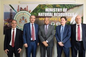 Minster of Natural Resources, Raphael Trotman (centre) with officials from Italian oil company ENI. (DPI photo)