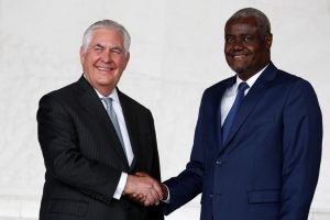 African Union (AU) Commission Chairman Moussa Faki, of Chad, and U.S. Secretary of State Rex Tillerson smile and shake hands for news photographers after their meeting at AU headquarters in Addis Ababa, Ethiopia March 8, 2018. REUTERS/Jonathan Ernst