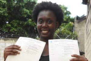 Juzzle Sayles proudly displays her examination certificates while speaking to the Jamaica Observer on Wednesday.