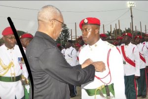 Orwain Sandy being decorated by Commander-in-Chief of the armed forces, President David Granger.