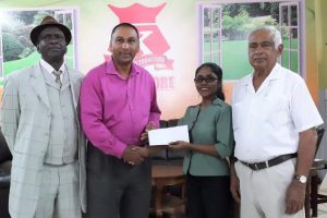 In picture at the handing over of the Kissoon’s Furniture Store sponsorship cheque are from right to left: CEO Hemraj Kissoon, Sales Manager, Christina Dhaneshar, LGC President Aleem Hossain and PRO Guy Griffith