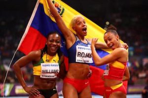 Kimberley Williams of Jamaica (left) shares a light moment with triple jump winner Yulimar Rojas of Venezuela and Ana Peleteiro of Spain on the podium at the IAAF World Indoor Championships. (IAAF Photo) 