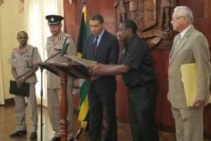 Prime Minister Andrew Holness is flanked by National Security Minister Robert Montague (second right), Justice Minister Delroy Chuck (right) along with Chief of Defence Staff of the Jamaica Defence Force, Major General Rocky Meade (left) and Acting Police Commissioner Clifford Blake as he announced the second state of public emergency in the St Catherine North Police Division yesterday morning at Jamaica House.