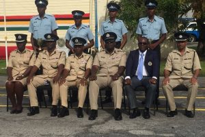 The best students of the four recruit courses with senior officers of the Guyana Police Force on Wednesday. (Seated from left are Assistant Commissioner Maxine Graham, Commander of ‘D’ Division Leslie James, Assistant Commissioner Operations Clifton Hicken, Assistant Commissioner and Force Finance Officer Nigel Hoppie, Crime Chief Paul Williams and Force training Officer Fazil Karimbaksh) 