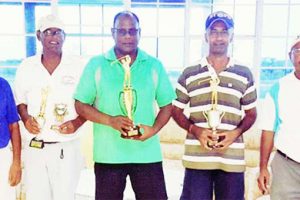Winner of Saturday’s Club President/Shafura Hussain Foundation memorial golf tournament Aasrodeen Shaw, centre displays the winning trophy. Others in picture are, from left, Bholaram Deo, Patrick Prashad, Mahesh Shivraj and Chatterpaul Deo.