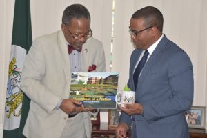 Vice Chancellor of UG, Prof. Ivelaw Griffith (left) with CDB official, Justin Ram (DPI photo)