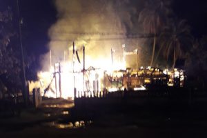 The No.45 village house being consumed by fire.