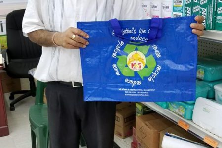 Harry Mattai displays one of the supermarket’s reusable shopping bags. The bags, which come in two sizes (the larger one is featured in the photo above) are sold for between $100 and $150.
