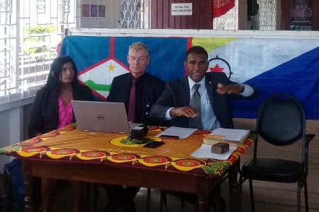 Davika Bissessar (left), President of We Dare to Care Foundation and Koert Kerkhoff (second from left), of the Brighter Path Foundation and a member of the former coalition government in Sint Eustatius look on as James Finies, President of the Foundation Nos ke Boneiru Bek (we want Bonaire back) makes a point during the press conference.