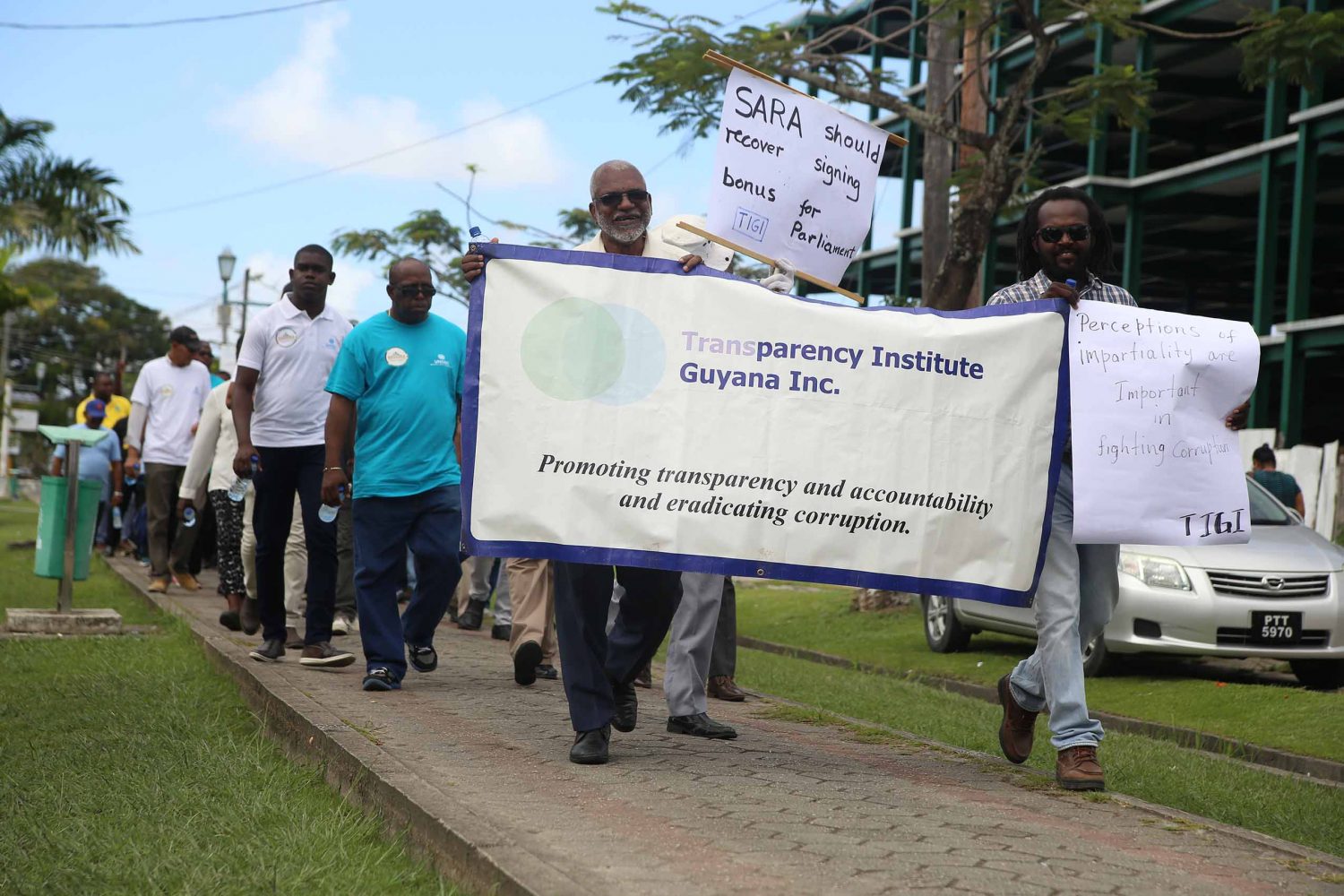 Members of the Transparency Institute of Guyana Inc. yesterday participating in the anti-corruption walk organised by the State Assets Recovery Agency (SARA) with support from the United Nations Office on Drugs and Crime. See story on page 3 (Terrence Thompson photo) 