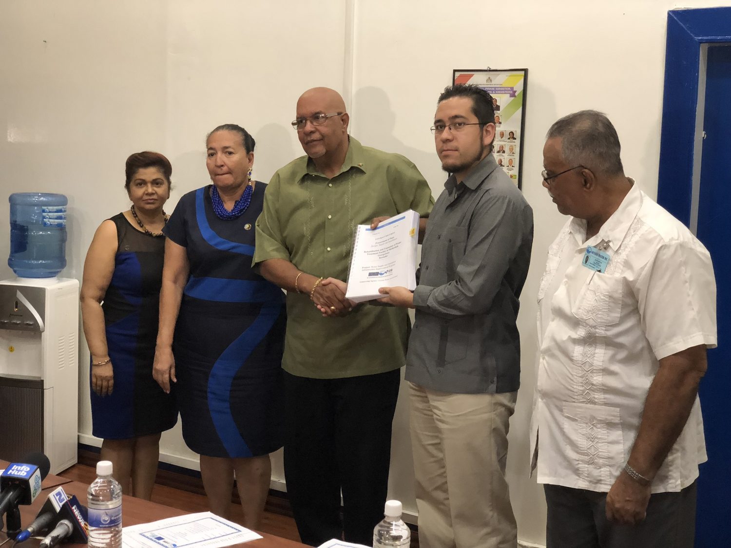 Managing Director of the Guyana Water Incorporated Dr. Richard Van West-Charles (at centre) collecting the signed agreement from representative of Hi-Pro Ecologicos S.A de C.V Luis Fabela (second, from right) along with Chairperson of the Board of Directors of GWI Patricia Chase-Green (second, from left) yesterday. 