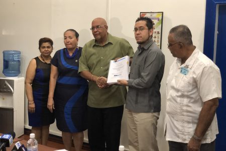 Managing Director of the Guyana Water Incorporated Dr. Richard Van West-Charles (at centre) collecting the signed agreement from representative of Hi-Pro Ecologicos S.A de C.V Luis Fabela (second, from right) along with Chairperson of the Board of Directors of GWI Patricia Chase-Green (second, from left) yesterday. 
