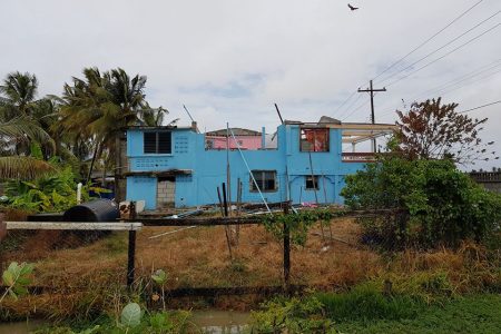 A house in the Lima Housing Scheme, Essequibo Coast, where the entire roof was blown away by heavy winds. (Regional Democratic Council of Region Two photo)