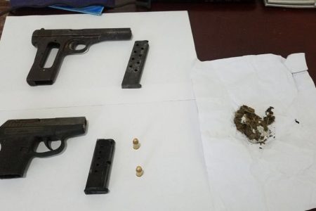 The guns, ammunition and cannabis found at the mining camp. 
