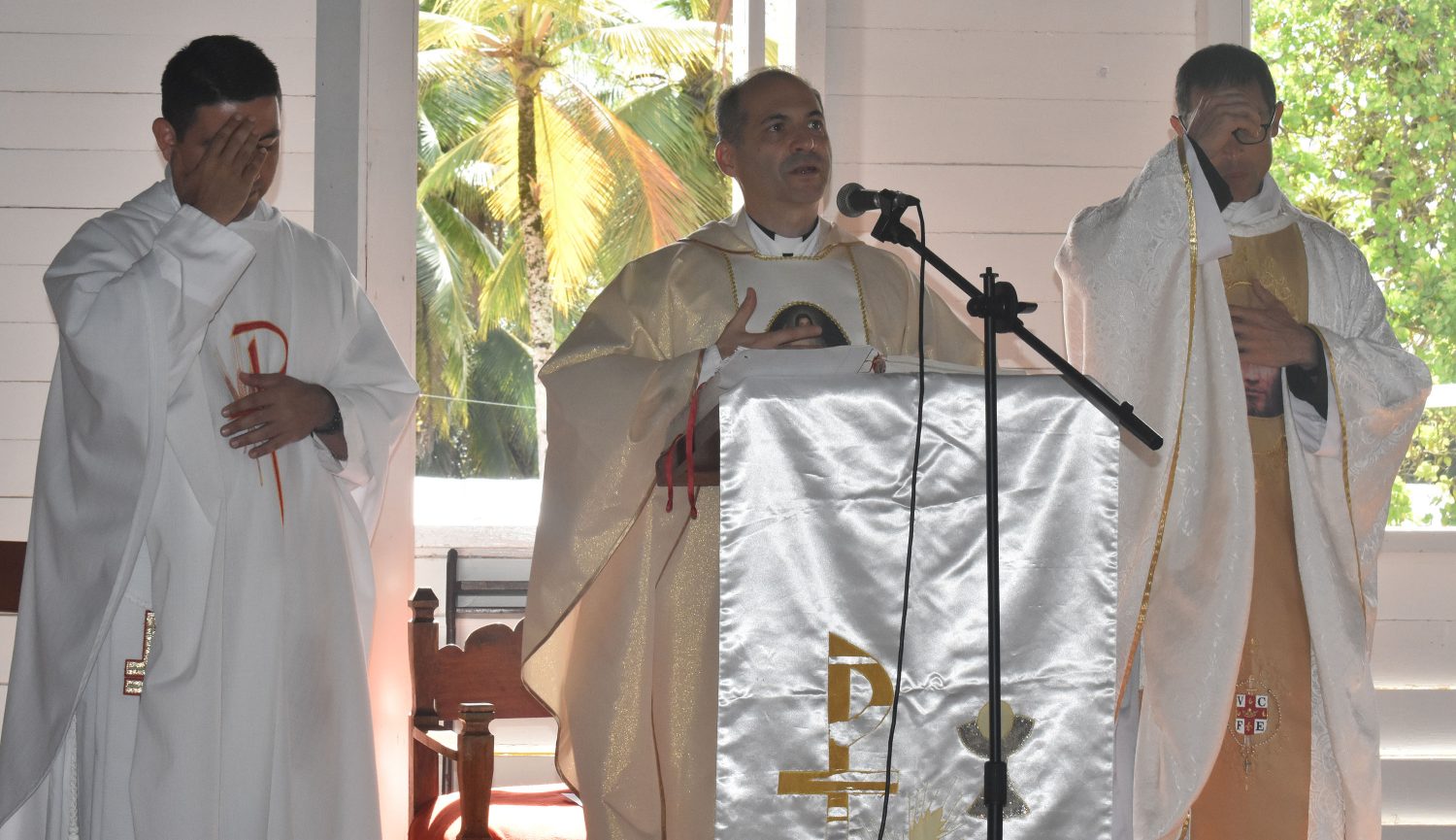 From left are parish priest Fr Pedro Torres (left), South American Provincial Superior Fr Alberto Baratero (centre) and assistant parish priest Fr Martin Mairena (right) at the anniversary mass on Sunday (Photo courtesy of Ministry of Indigenous Peoples’ Affairs)