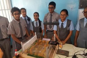 Students from St Stanislaus College proudly display their ‘Walls of Stone’ project at the 14th Biennial STEAM Fair at St Joseph High School, Woolford Avenue, Georgetown