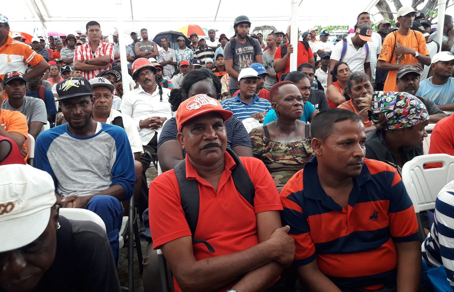 Former sugar workers gathered at Line Path yesterday to receive hampers