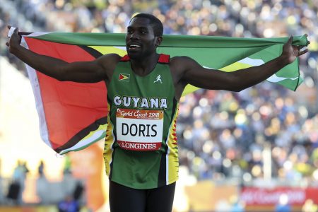 Guyana's Troy Doris celebrates after winning in the men's triple jump final at Carrara Stadium during the 2018 Commonwealth Games on the Gold Coast, Australia, Saturday, April 14, 2018. (AP Photo/Mark Schiefelbein)