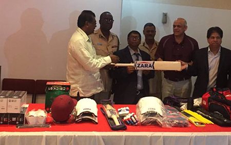 Zara Group of Companies Executive, Jay Subraj (second from right) and other representatives of the Zara Group handing over the items to Minister of Public Security Khemraj Ramjattan.