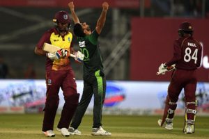 Medium pacer Hussain Talat celebrates the final wicket of Samuel Badree (left) in yesterday’s first Twenty20 International. (Photo courtesy ICC Media) 
