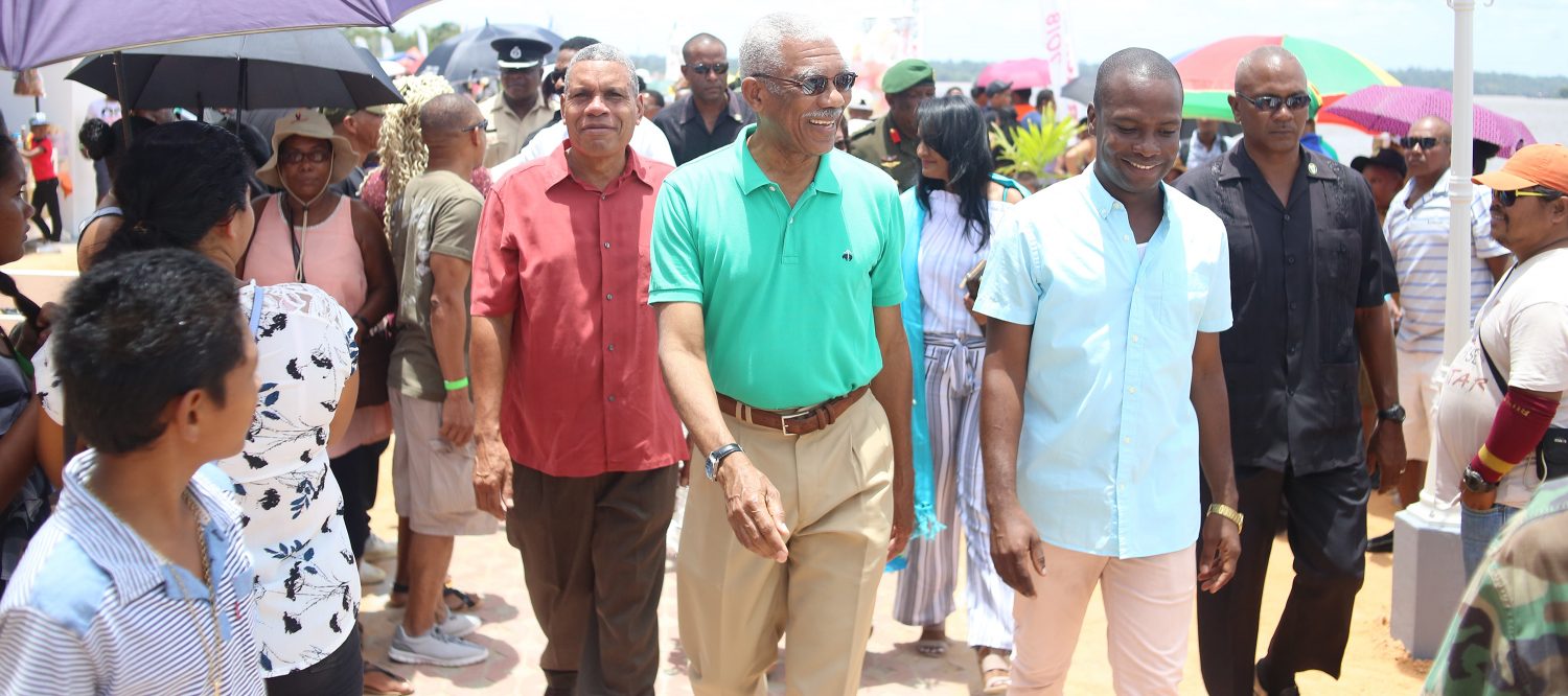 President David Granger (centre) along with the Regional Chairman of the Cuyuni-Mazaruni, Gordon Bradford (left) and Mayor Gifford Marshall (right) taking a stroll along the boardwalk. (Ministry of the Presidency photo) 