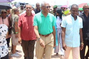 President David Granger (centre) along with the Regional Chairman of the Cuyuni-Mazaruni, Gordon Bradford (left) and Mayor Gifford Marshall (right) taking a stroll along the boardwalk. (Ministry of the Presidency photo) 