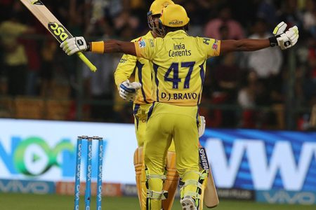 Dwayne Bravo and Mahendra Singh Dhoni celebrate their team’s victory over Royal Challengers Banglaore. (Photo courtesy of IPL website)
