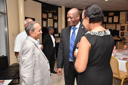 Minister of State, Joseph Harmon in discussion with Chairman of the PSC,  Eddie Boyer (left)  and Executive member of the PSC, Elizabeth Alleyne. (Ministry of the Presidency photo)