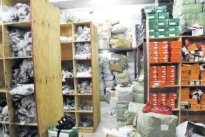 Shelves packed with what the police say are counterfeit products are seen inside one of two stores on Princess Street in downtown Kingston yesterday. Police seized the goods which they estimated to be valued at more than $300 million.
