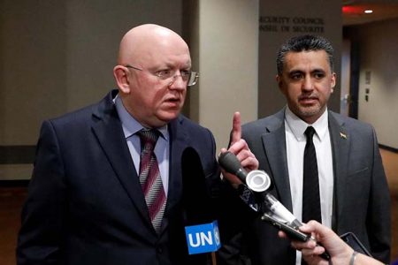 Vassily Nebenzia, Moscow’s ambassador to the United Nations (left) with Bolivia’s Ambassador Sacha Sergio Llorenty. (Reuters photo)  
