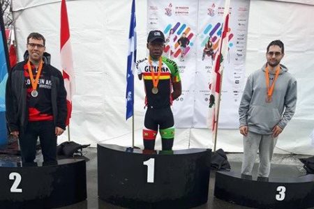 Guyana’s Walter Grant Stuart stands proudly atop the podium after winning the UCI CI Para-Cycling Road Race event yesterday in Canada.