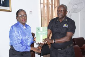 Minister of Education Nicolette Henry (left) receiving the report from Permanent Secretary of the Ministry of Education, Vibert Welch
