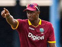 West Indies captain Jason Holder poses with the ICC World Cup qualifying tournament trophy. (Photo courtesy CWI Media)
