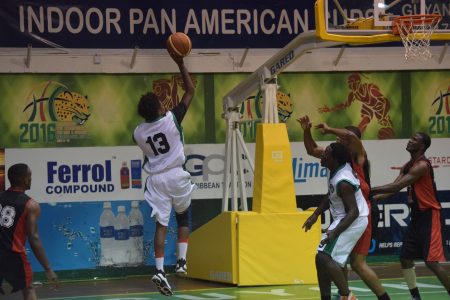 Sebastian Luke of Ravens attempting a block on a Retrieve Raiders player during their encounter at the Cliff Anderson Sports Hall in the GABF ‘Road to Mecca’ Club Championship