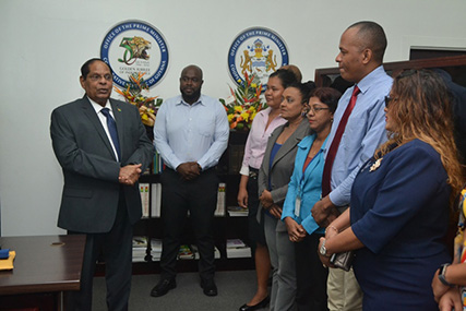 Prime Minister Moses Nagamootoo (left)  addressing staff at OPM.  (DPI photo)