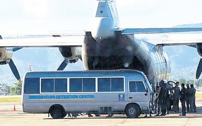 A military aircraft at Piarco International Airport waiting to take Venezuelan immigrants back to their homeland on Saturday. (Ministry of National Security photo)