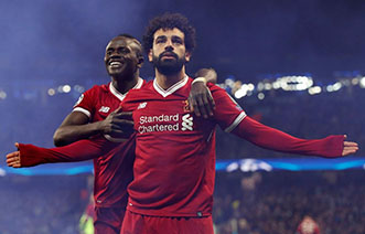 Liverpool’s Mohamed Salah celebrates scoring their first goal with Sadio Mane REUTERS/Andrew Yates. 